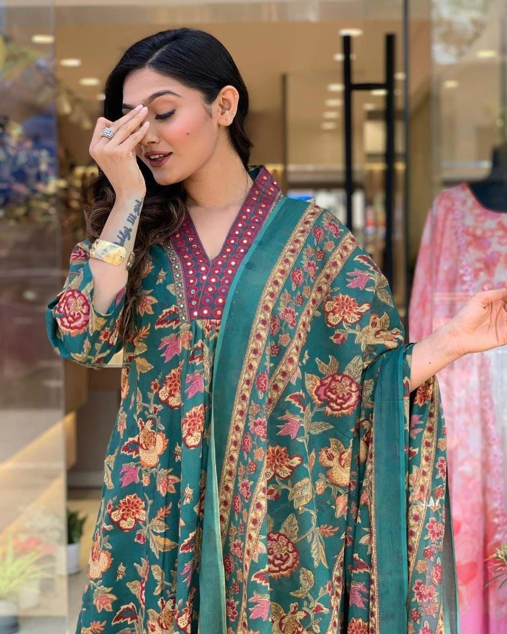 This A-line pant set is perfect for the summer season with its vibrant floral print and confident pocket one side. Plus, the included matching dupatta completes the look and adds an extra touch of style.(WARED205)