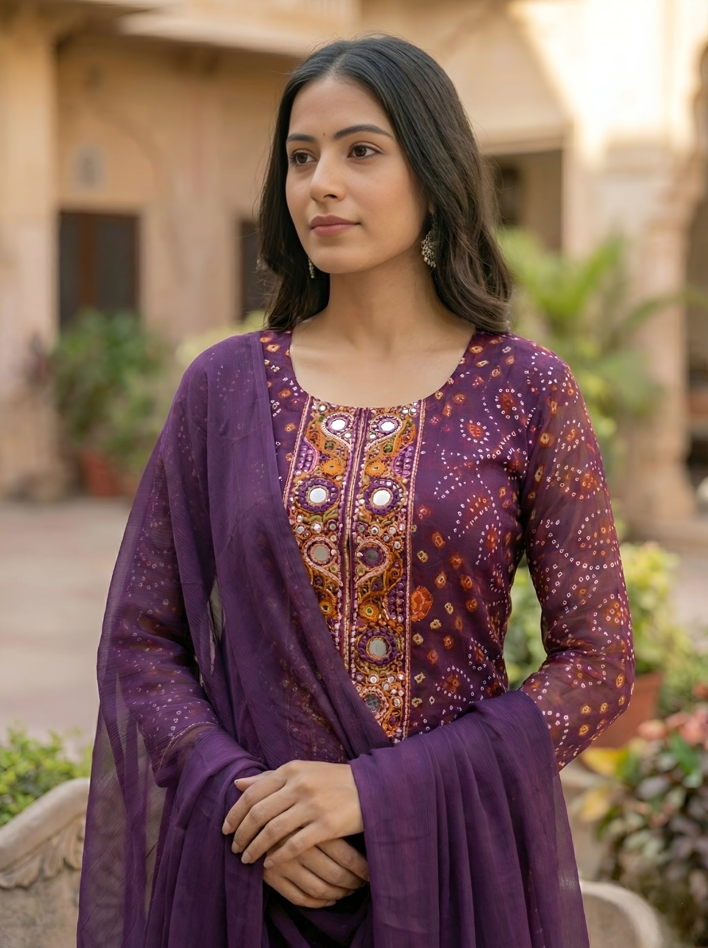 A Rich Purple And Pink Bandhani Printed Plazo set Featuring An Embroidered Front Panel, Flowy Matching Bottoms and A Sheer Dupatta For An Elegant Ethnic Look. (NFRD01)