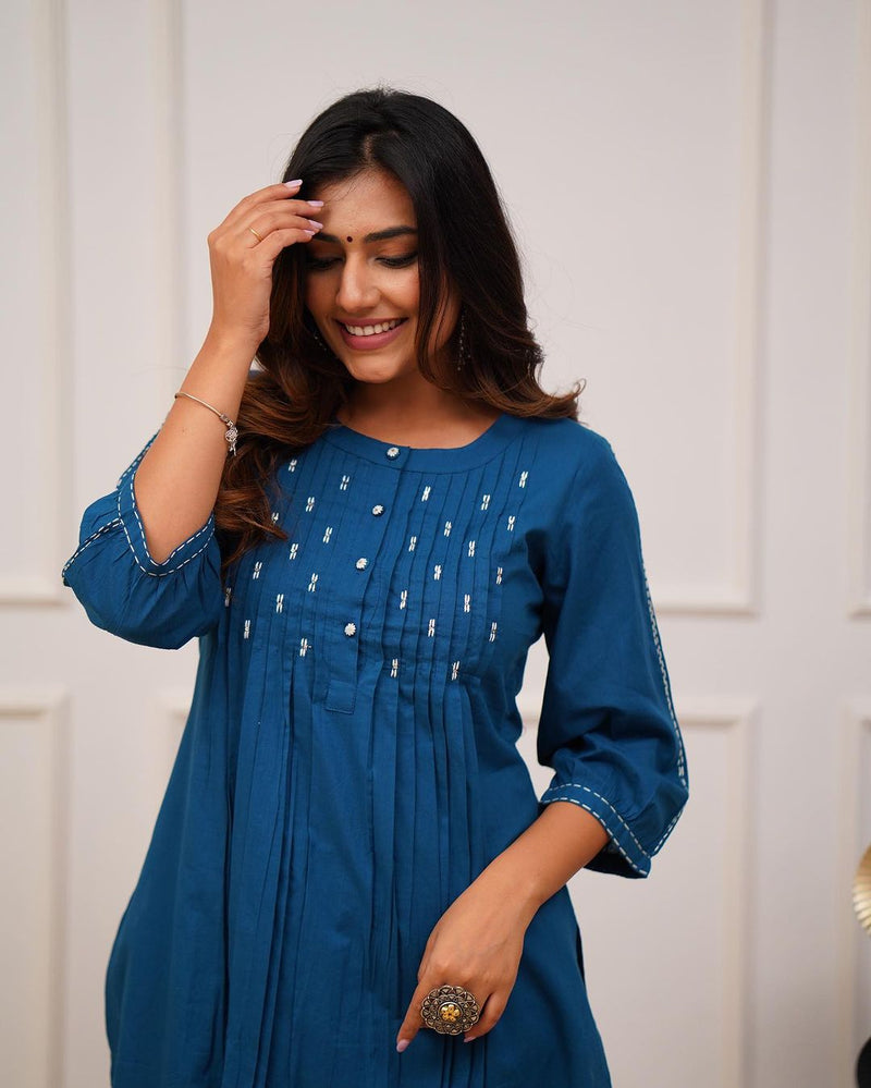 Upgrade your office wear wardrobe with this classy *teal blue kurti pant with beautiful manual tagai &amp; button work detailing for all day comfort and trendy look