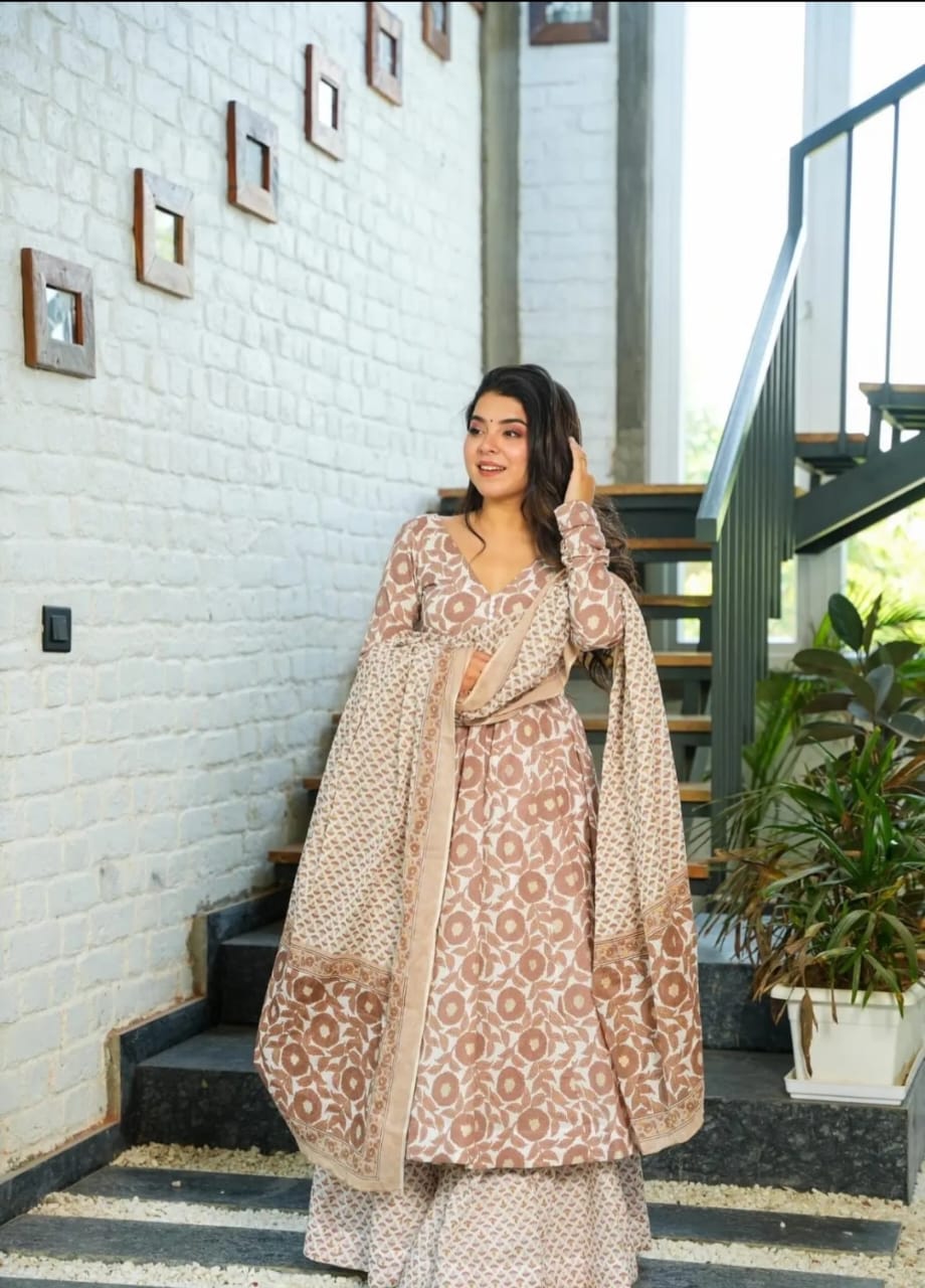 looks elegant in a stunning brown anarkali suit. The intricate embroidery adds sophistication,