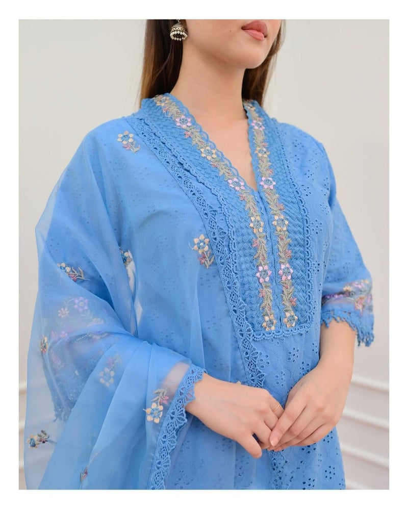 New Pakistani Schiffli Cutwork Suit set. Crafted with delicacy, the kurta has beautiful embroidery all-over. The embroidered sleeves and bottom adding an extra touch of elegance