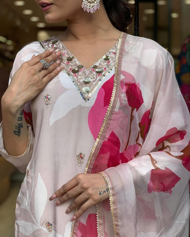 Make a change in your wardrobe by wearing our exclusive muslin digital print hand embroidery suit with muslin duppata