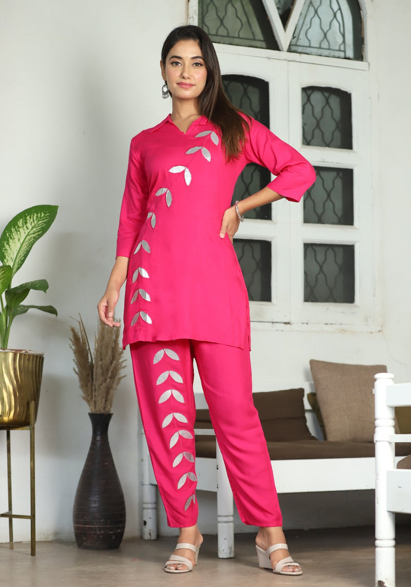 A mirror work kurti paired with pants exudes timeless charm and contemporary elegance.