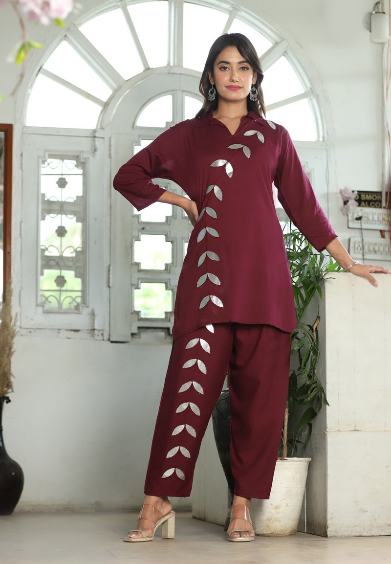 A mirror work kurti paired with pants exudes timeless charm and contemporary elegance.