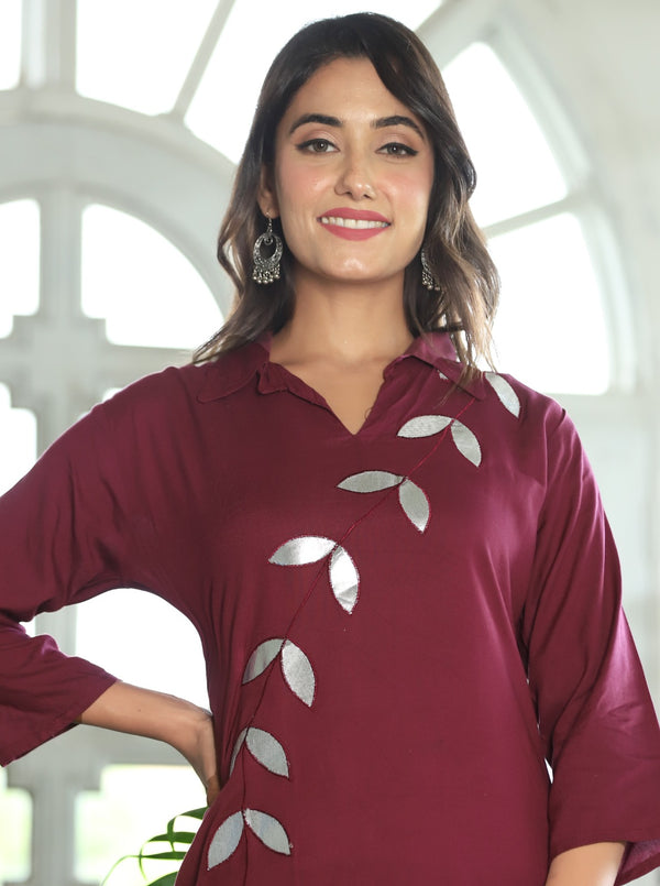 A mirror work kurti paired with pants exudes timeless charm and contemporary elegance.