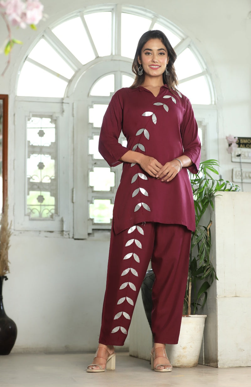 A mirror work kurti paired with pants exudes timeless charm and contemporary elegance.