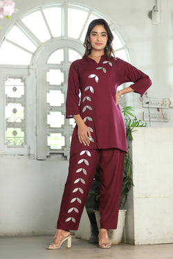 A mirror work kurti paired with pants exudes timeless charm and contemporary elegance.