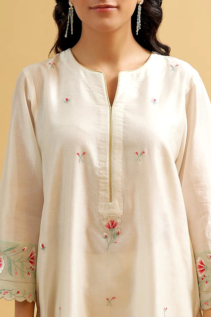 A traditional yet Stylish Kurta with colour full threadwork hand embroidery.