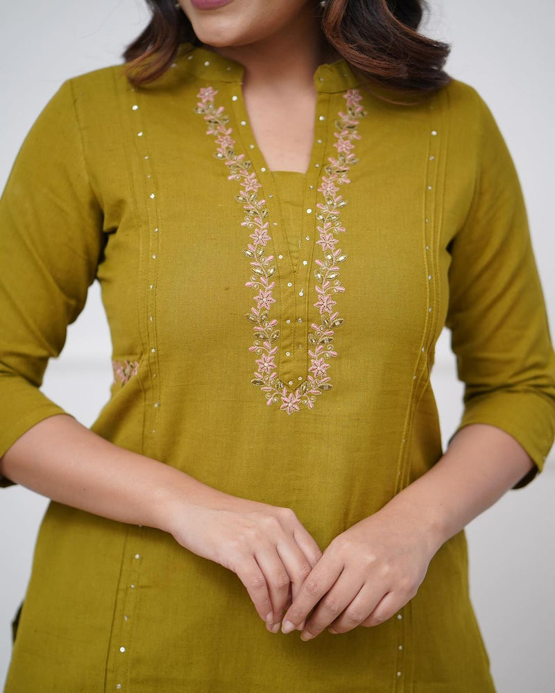 Pure cotton pleated pattern kurta with heavy embroided panels and sequence work..