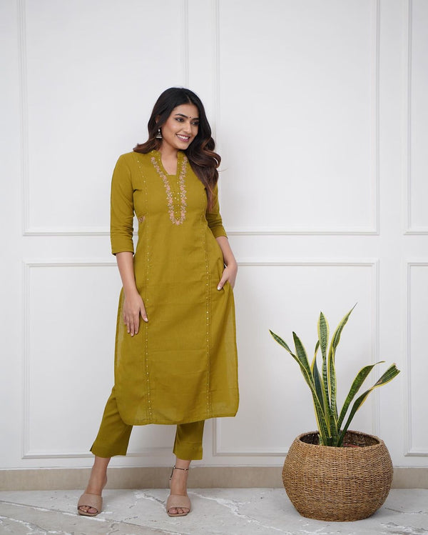 Pure cotton pleated pattern kurta with heavy embroided panels and sequence work..