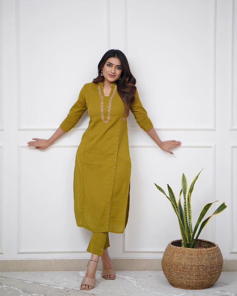 Pure cotton pleated pattern kurta with heavy embroided panels and sequence work..