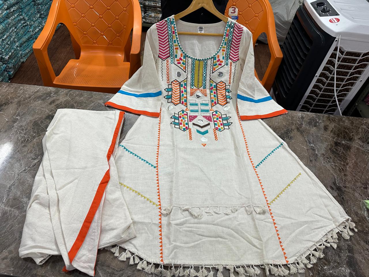 New in festive embroidery work kurta dhoti set. Get your hands on our beautiful off-white kurti with intricate thread embroidery work less