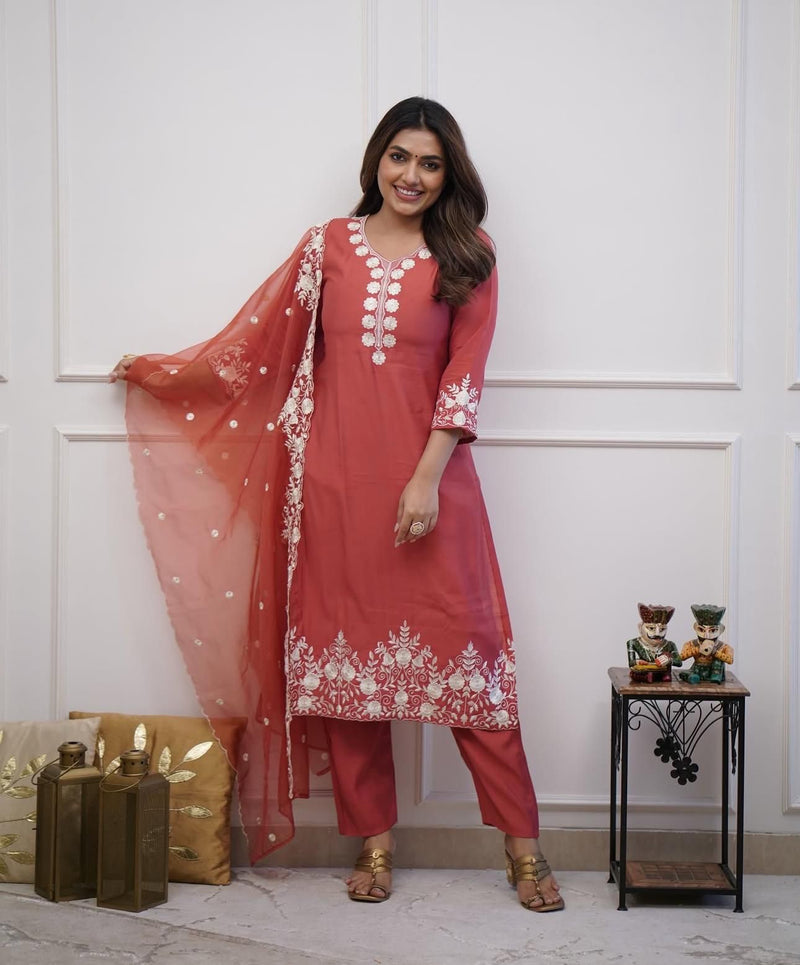 Featuring beautiful Roman silk Suit set which is beautifully decorated It is paired with matching colour pants(NFRD282)