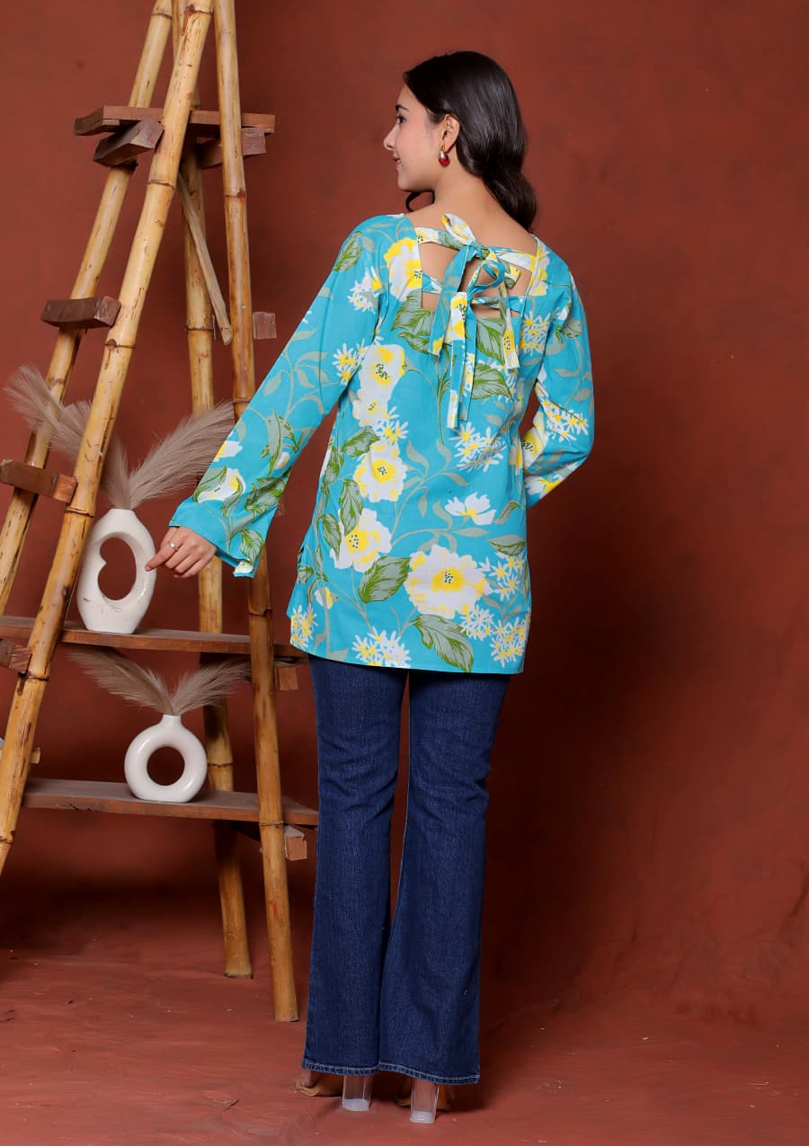 Elevate your ethnic wardrobe with this chic and vibrant fuchsia pink blue skay green  kurti. Featuring a striking white lily print, this piece is designed for the modern woman who loves a mix of classic charm and edgy details.(RRRD40