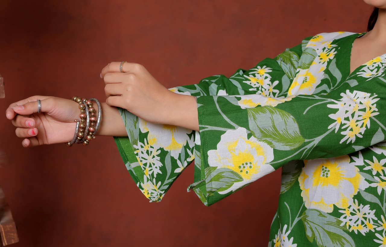 Elevate your ethnic wardrobe with this chic and vibrant fuchsia pink blue skay green  kurti. Featuring a striking white lily print, this piece is designed for the modern woman who loves a mix of classic charm and edgy details.(RRRD40