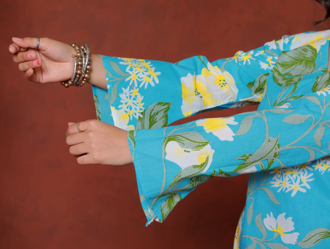 Elevate your ethnic wardrobe with this chic and vibrant fuchsia pink blue skay green  kurti. Featuring a striking white lily print, this piece is designed for the modern woman who loves a mix of classic charm and edgy details.(RRRD40