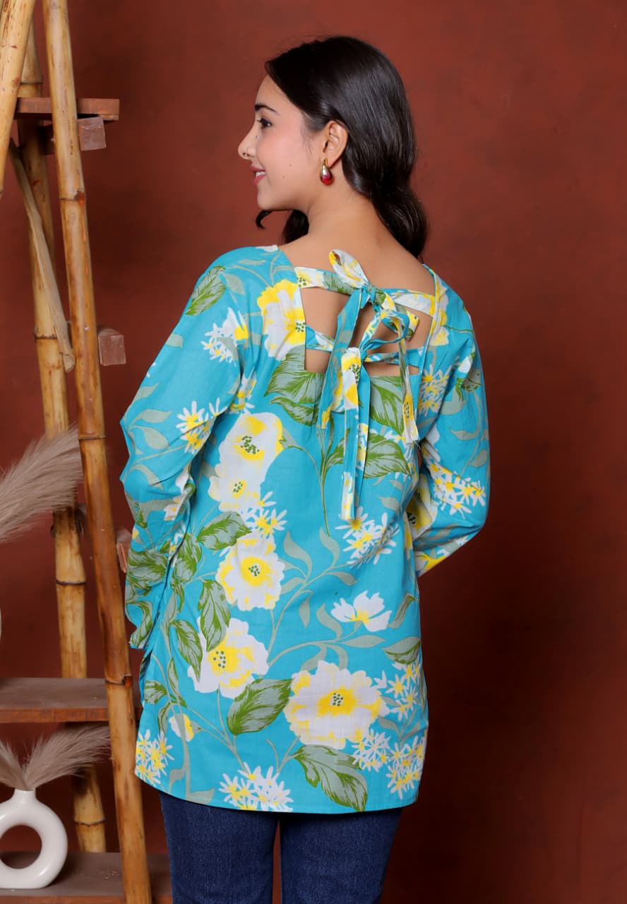 Elevate your ethnic wardrobe with this chic and vibrant fuchsia pink blue skay green  kurti. Featuring a striking white lily print, this piece is designed for the modern woman who loves a mix of classic charm and edgy details.(RRRD40